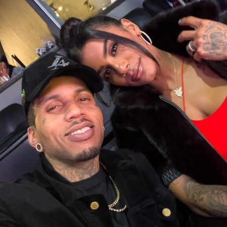 Julain Goins's brother Kid Ink and his wife.